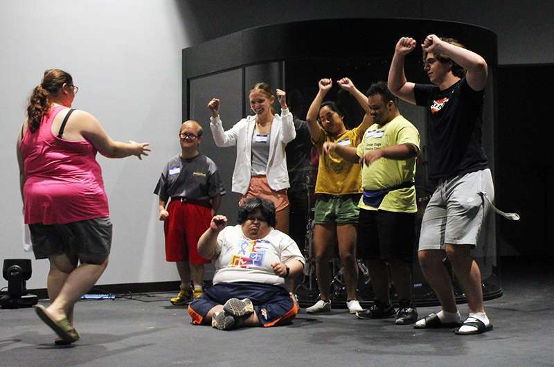 Campers and volunteers rehearse a dance at the Center Stage Theatre Camp.