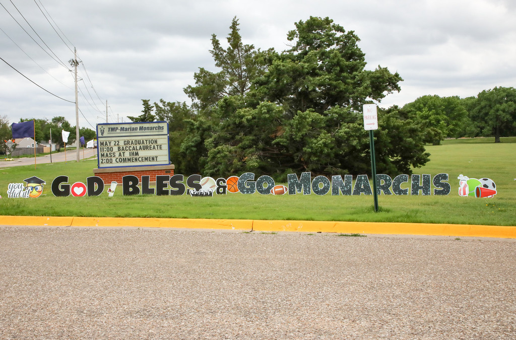God bless and go monarchs sign on TMP-M's campus