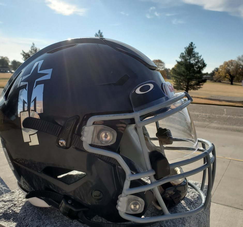TMP-M football helmet with campus in background