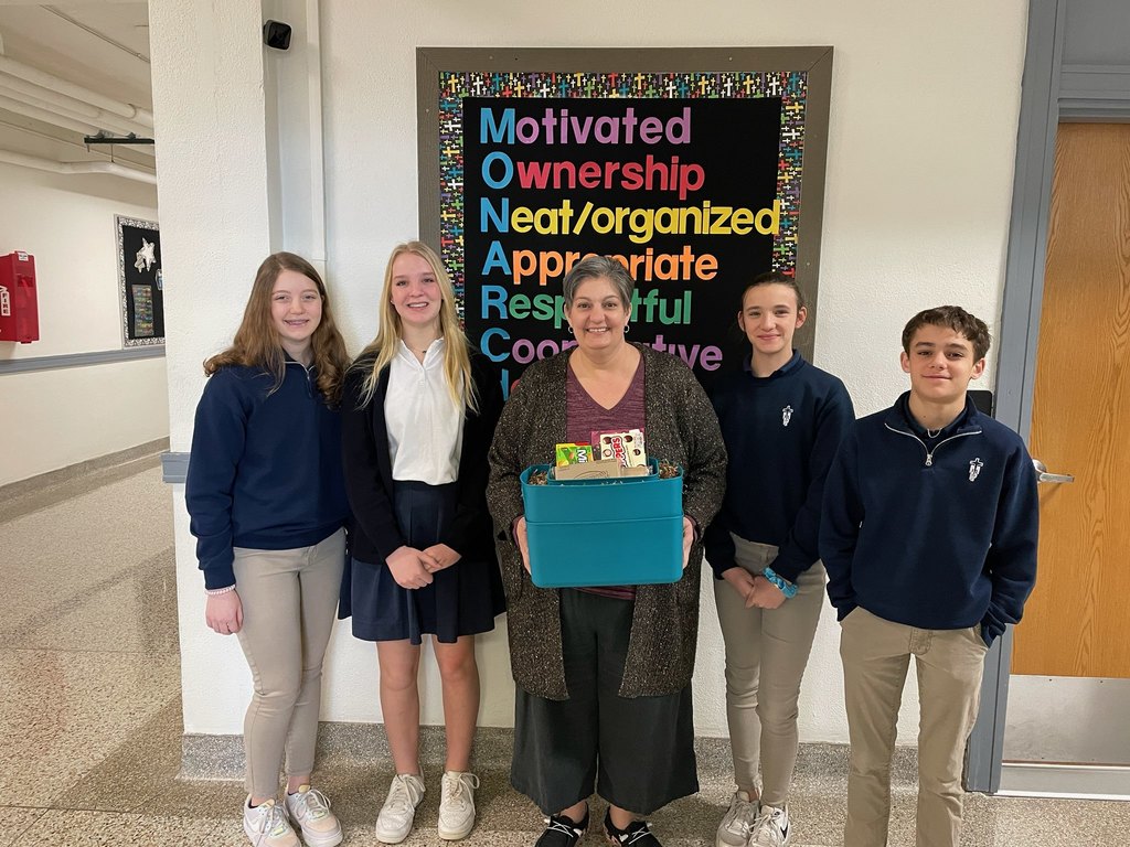 Student Council representative present Miss Jennie Helget with Teacher of the Quarter for Q2.