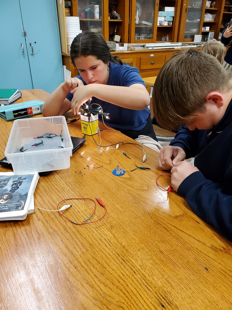 Students work on their electricity lab in Physics I