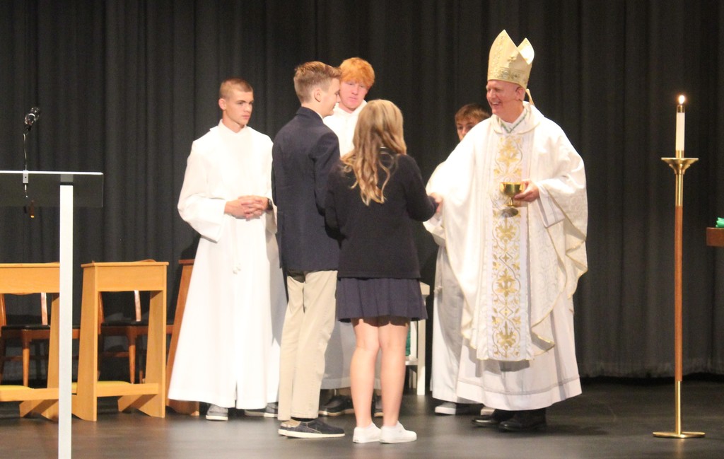 Bishop celebrates mass with TMP students.